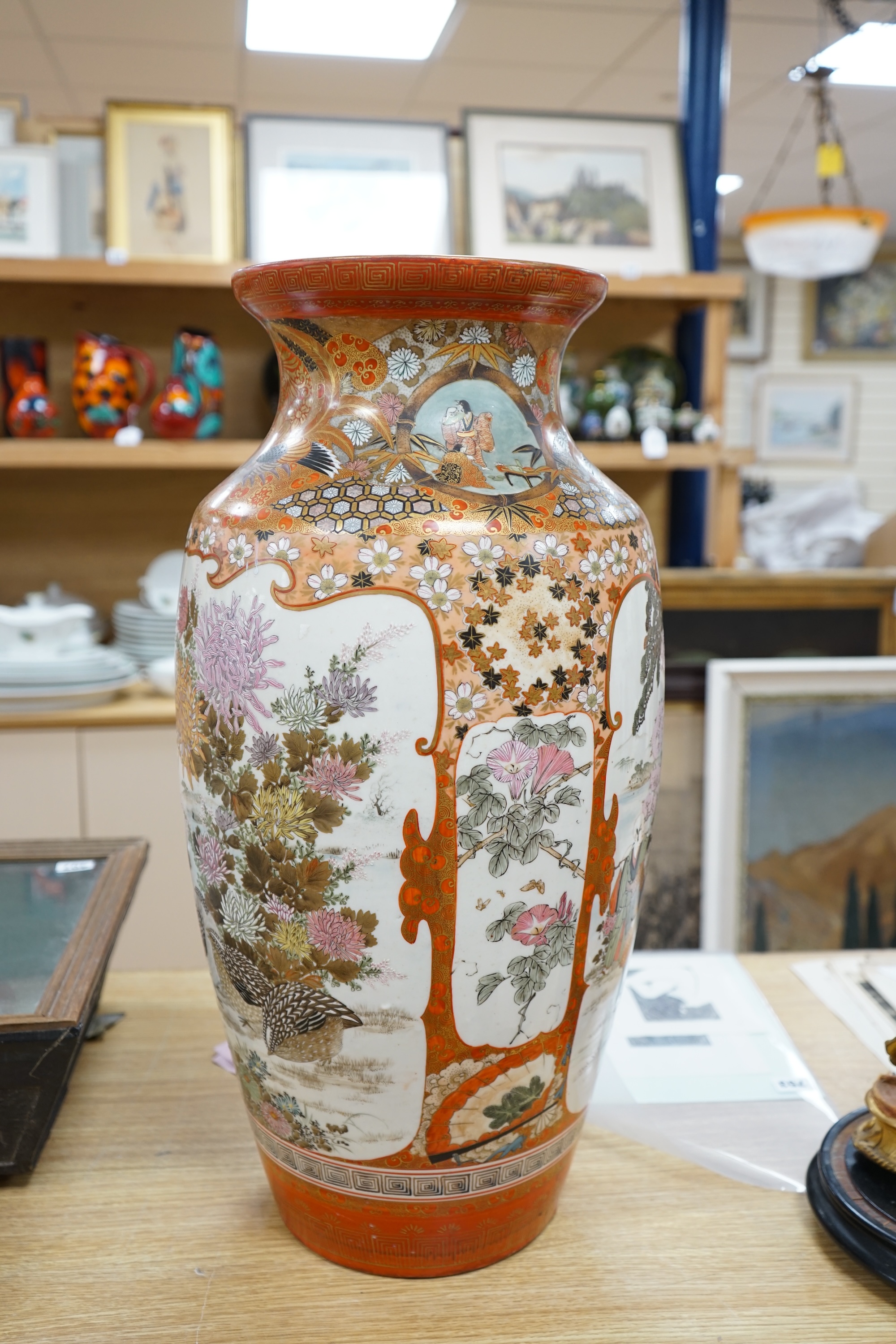 A massive Japanese kutani vase, hand painted with figures, quails and flowers, signed to the base, 61cm high. Condition - good